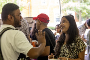 Students socialize at the International Coffee Hour 50th Anniversary Celebration, August 19, 2022