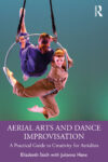 E Stich Two women perform aerial arts on a hoop against a green and blue background. The book title reads Aerial Arts and Dance Improvisation by Elizabeth Stich with Julianna Hane.